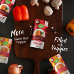 Taltis Foods Jollof Sauce displayed in a creative flat lay with fresh sweet bell peppers, mushrooms, and onions, highlighting the pouch's rich vegetable content and the 'More Sweet Bell Pepper, Filled With Veggies' message, perfect for a nutritious and flavorful meal.