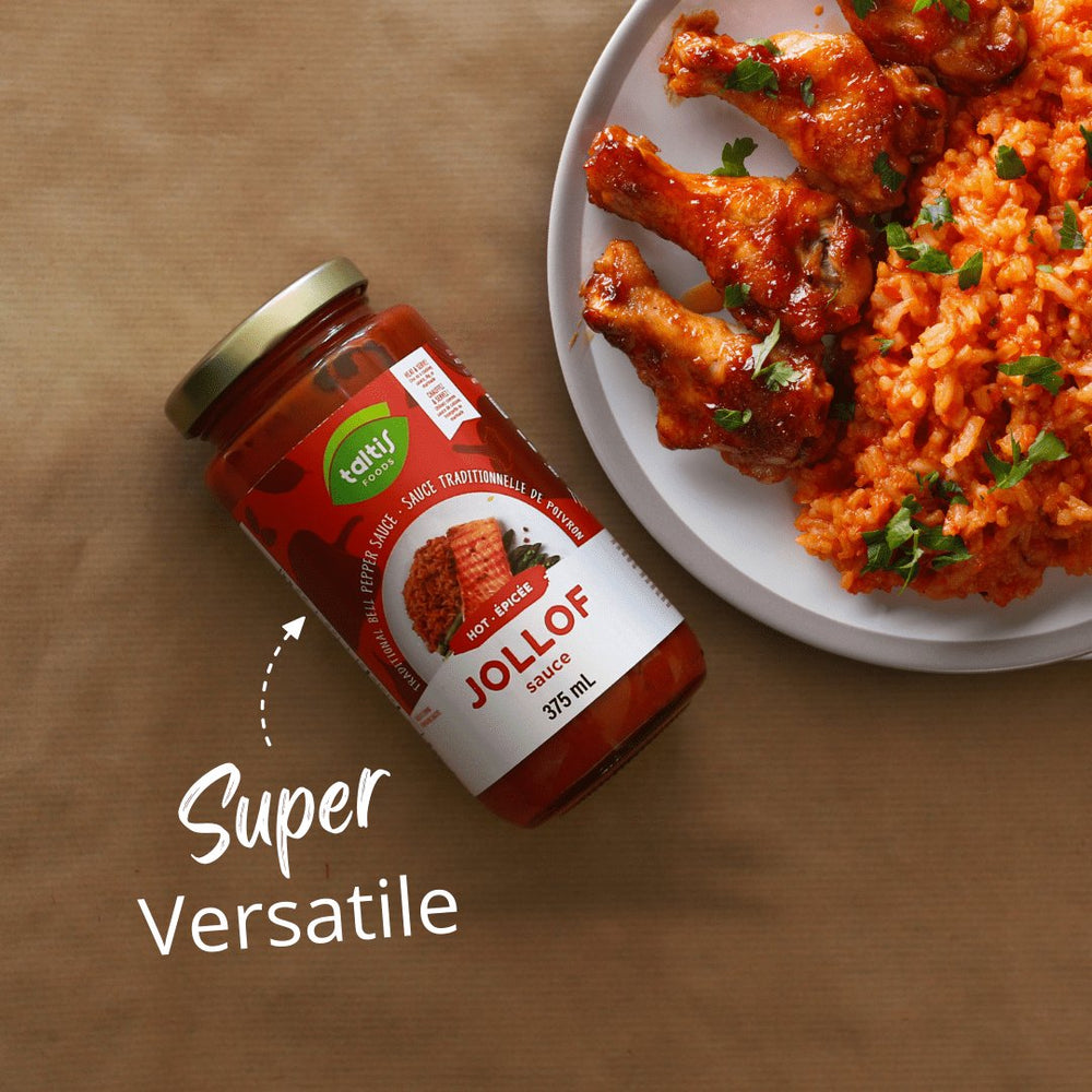 Taltis Foods Hot Jollof Sauce in a 375 mL jar, presented as 'Super Versatile' on a kitchen countertop, with a plate of Jollof rice and grilled chicken in the background, showcasing the sauce's adaptability to different dishes.